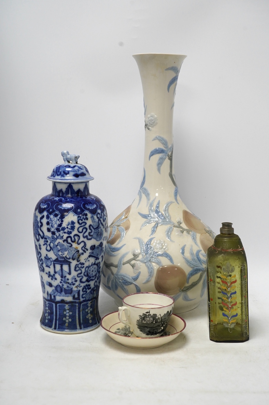 Four ceramic items including a large Lladro vase, 47.5cm high, a Chinese lidded vase, an early 19th century painted bottle and a lustre teacup and saucer. Condition - fair to good